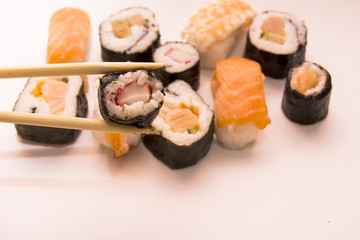 Pieces of sushi on white background
