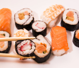 Pieces of sushi on white background