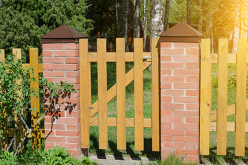 brick and wooden fence