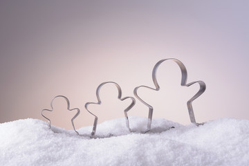 Cookie cutters for Christmas cookies in the snow