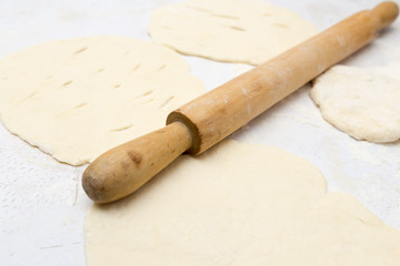 rolling dough with a rolling pin