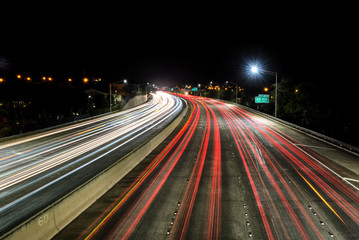 Fototapeta na wymiar Light trails over H1 highway in Honolulu, Hawaii