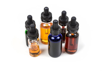 Assorted flavors of vape juice isolated on white background