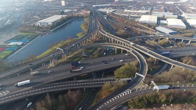 Tilting aerial view of Spaghetti Junction and Birmingham city centre, UK.