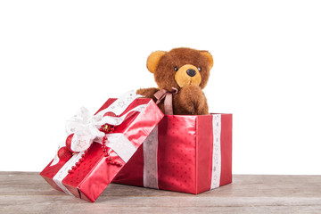 Christmas gifts on a white background with donated bear