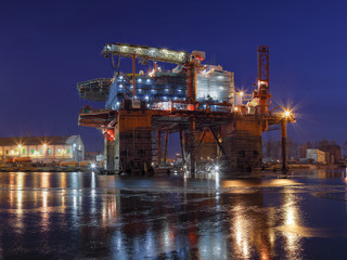 Fototapeta na wymiar Oil rig under construction at night in Gdansk, Poland.