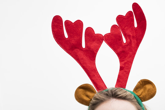 Festive christmas reindeer antler headband on a female head