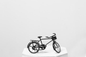 Fototapeta na wymiar Toy bicycle isolated on grey background.