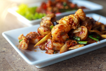 Seafood spicy in rectangle dish,Selective focus.