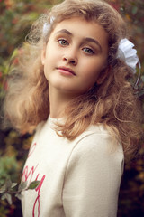 Naklejka premium Beautiful teenage girl 10 years old, adorable face looking strai