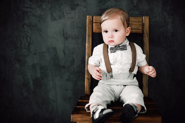 Fototapeta premium two babies wedding - boy dressed as groom, little gentleman dressed in bow-tie