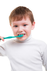 Boy without baby teeth with toothbrush