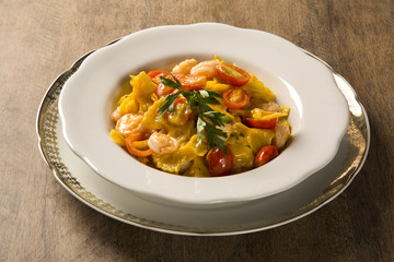 Pumpkin farfalle with shrimp and cherry tomato