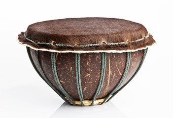Original african djembe drum with leather lamina with beautiful hair on white background