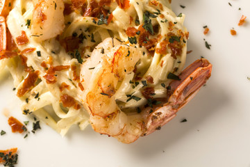 Pasta with shrimps served thyme and cheese