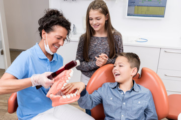 Dentist having Fun with two kids