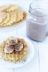 cocoa and waffles with banana for breakfast