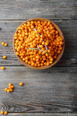 Berry sea buckthon on wood