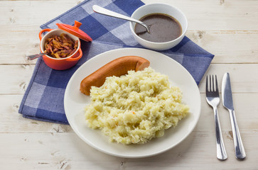 Typical dutch dish zuurkool with sauerkraut, smoked sausage and