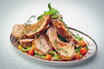 juicy meat served with herbs and vegetables