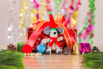 Fototapeta premium christmas santa claus toy on background of colorful garland ligh