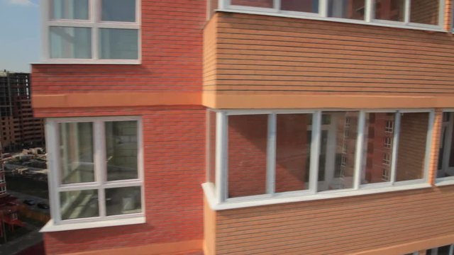 New buildings for young families in Moscow. The camera moves close to the Windows of the building