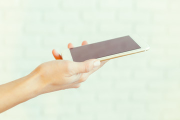 Woman with modern mobile phone in hands