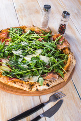 Pizza on wooden background