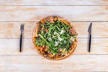 Pizza on wooden background