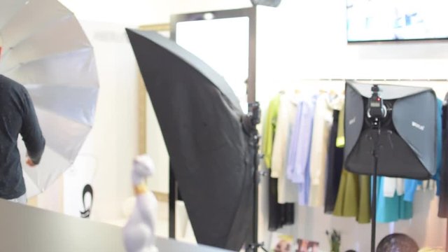 professional photographer sets a photographic studio. Hands close-up.
