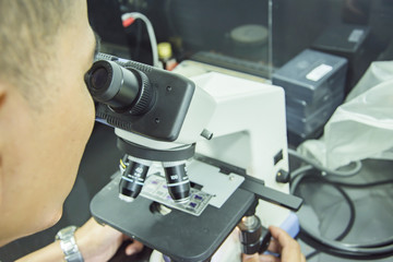 medical men use microscope blood culture in Laboratory room
