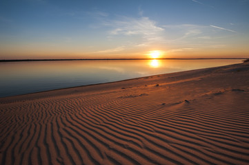 Beautiful sunset on the beach of the Volga river
