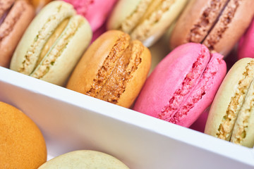 Colorful french macaroons in a box