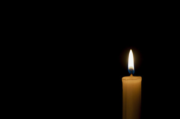 Candle on a black background