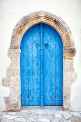 Close up of an old wooden blue door.
