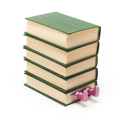 Pile of books and boots jut out