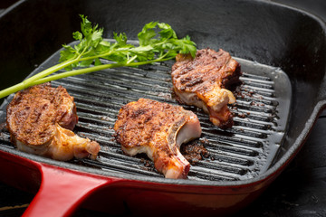 Fried lamb steak on grill pan