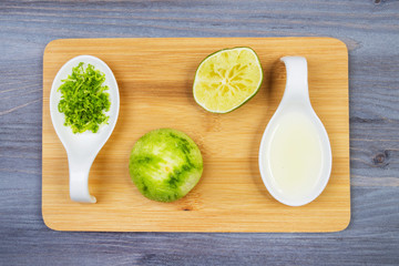 Wooden spoon and ingredients on dark background. Vegetarian food, health or cooking concept