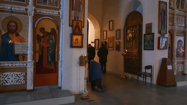 People pray in temple of russian orthodox church