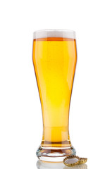 Beer glass and corks on white background