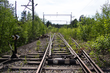 Old rusty railway tracks with wooden sleepers