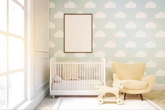 Close up of a child's room with cloud wallpaper on blue wall, to