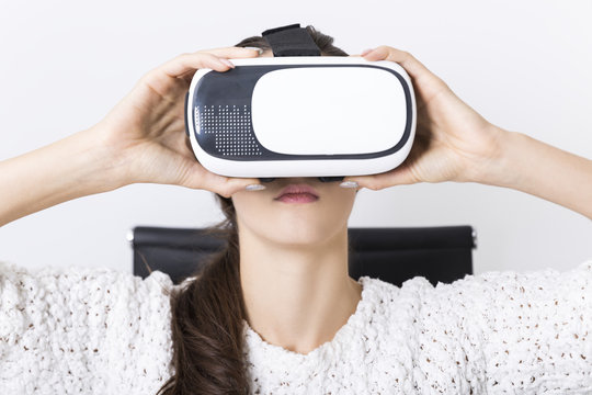 Woman with long brown hair wearing vr glasses