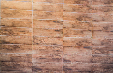 floor background and texture of decorative redwood stripe on wall / marble tiled floor / tile brown floor background.