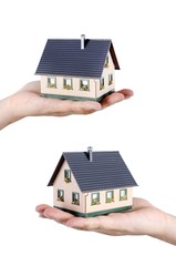 Hand holding house miniature. Home finance concept