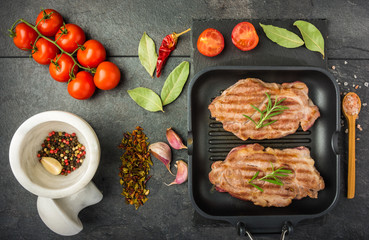 steak with spices and tomatoes 
