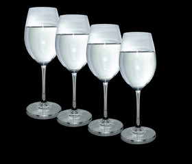 Water in glass isolated on black background