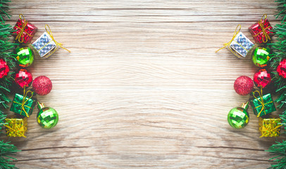 christmas gift boxes and balls background on wooden texture