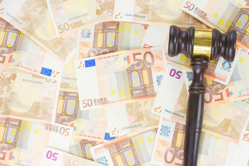 Wooden Law Gavel and Euro Money Banknotes background