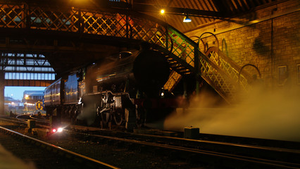 Atmospheric Scottish steam locomotive in station © Ralph Musto